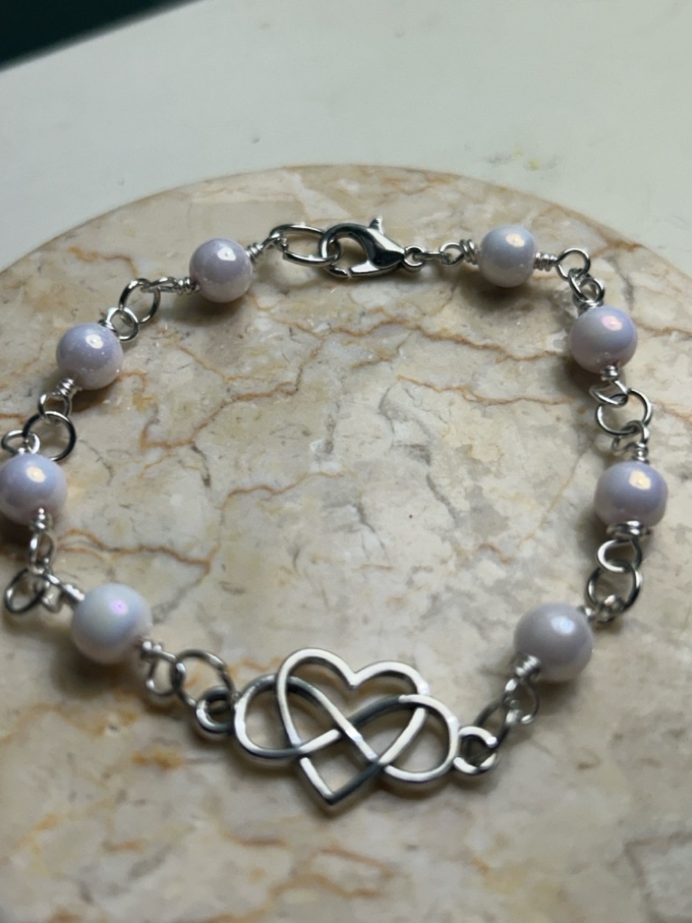Silver Heart Infinity Beaded Bracelet in Iridescent  and Iridescent pink